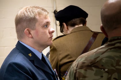 RAFAC instructor looking off picture whilst wearing a blue uniform