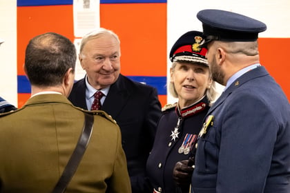 Lord Lieutenant of Essex in uniform talking to RAFAC and ACF Adults. All wearing formal uniform. Man in the background smiling whilst wearing a suit.