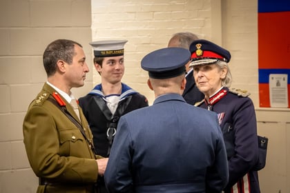 Lord Lieutenant of Essex in uniform talking to RAFAC and ACF Adults. All wearing formal uniform. Sea cadet in uniform stands in the background.