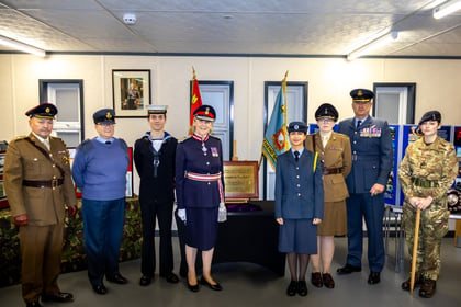 Photos of various dignitaries from the Army Cadets and Air Cadets standing with the Lord Lieutenant in front of her plague.