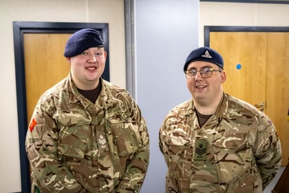 Two Army Cadet NCOs stand in MTP uniform.