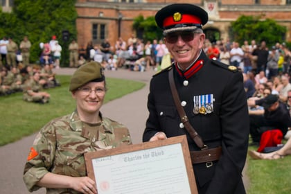 Lt Edwards receives Commissioning Scroll
