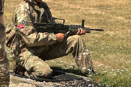 Cadets demonstrating marksmanship and range discipline during 3-Star shooting training.