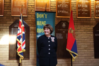 The Lord Lieutenant of Suffolk smiling at the award presentation