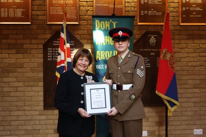The Lord Lieutenant Cadet for Suffolk ACF with Lady Euston showing his certificate