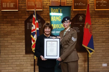 Suffolk ACF Cadet with the Lord Lieutenant showing her award