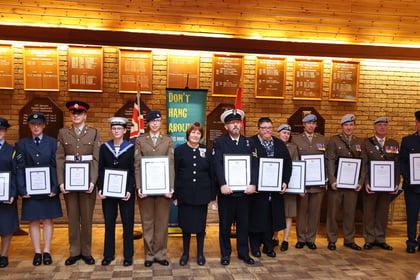All of the award recipients lined up either side of the Lord Lieutenant holding their awards