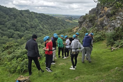Cadets standing in a waiting area before rock climbing