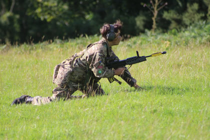 A Cadet conducting fire and movement during blank firing