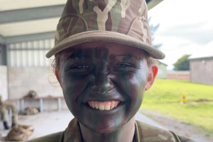 Smiling cadet with too much camcream on