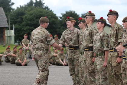 Commandant shaking hands with cadets
