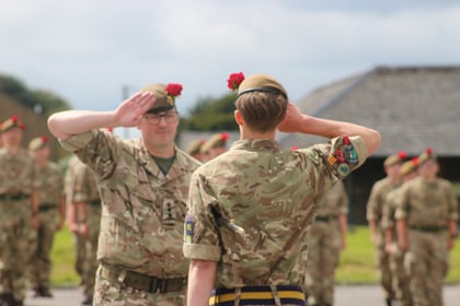 Commandant and Cadet RSM both saluting each other