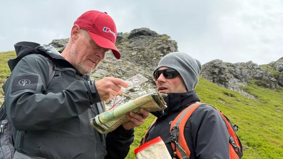 Adult Volunteers in Wales reading map for Navigation exercise