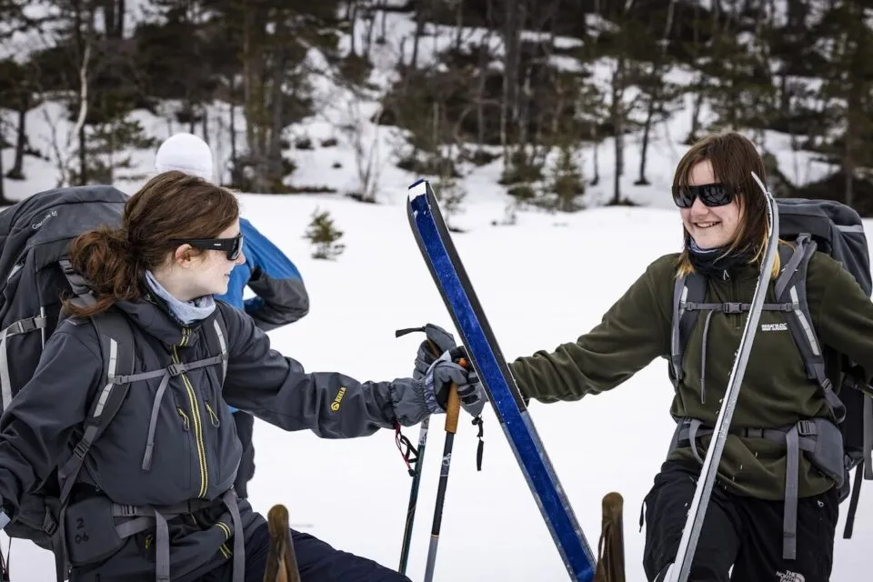 Two female cadets wear skiing gear in Norway