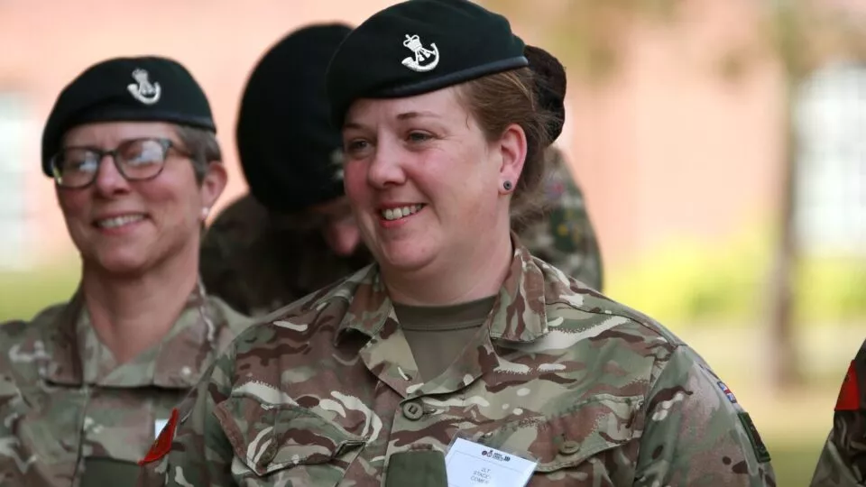 Female officer smiles during Initial Officer Training