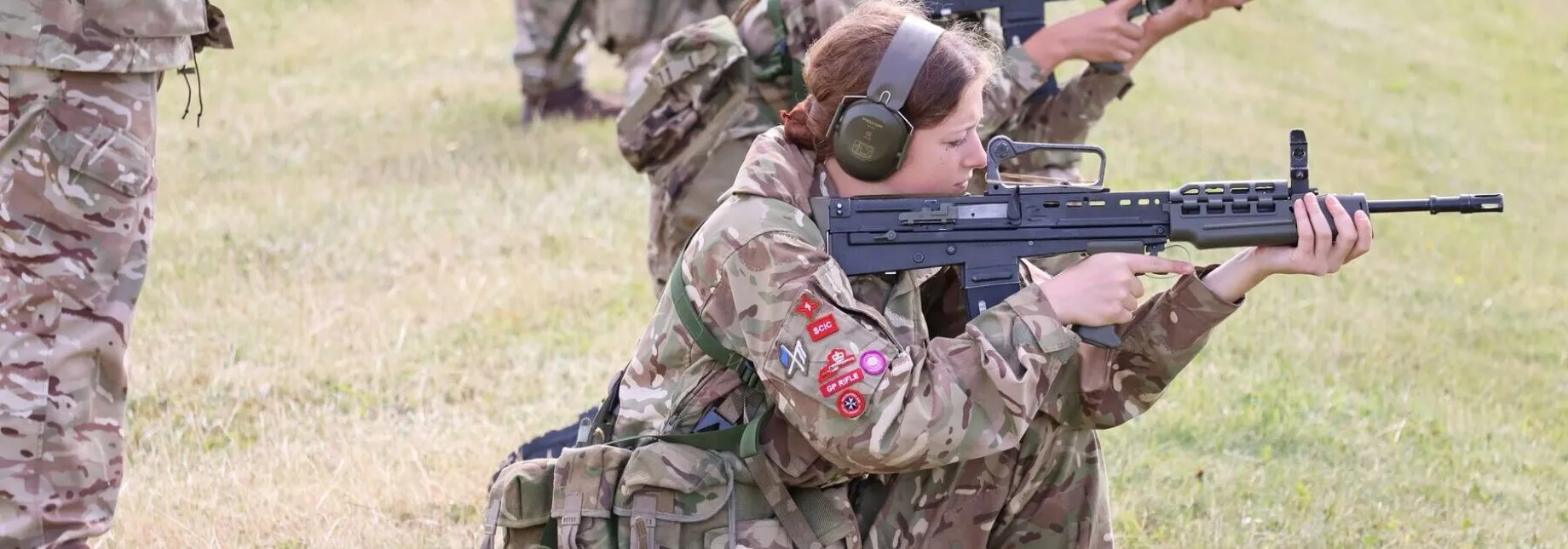 Female cadet firing weapon