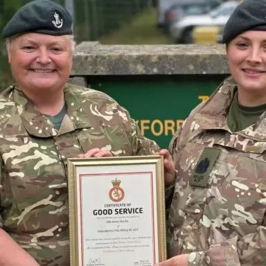 Lt Col Sarah Oxford hands certificate over to a cadet
