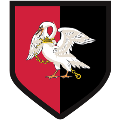 The crest of Buckinghamshire. It is Red on the left hand side and Black on the right hand side, the colours are split down the middle and has a Black border around the crest. There is a White Swan in the middle, it has a Gold chain around its neck which goes around the front of the body, to the back of the swans feet.