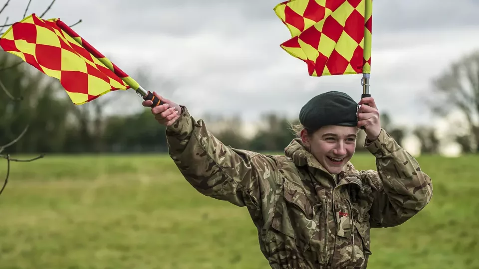 Cadet doing signals with flags