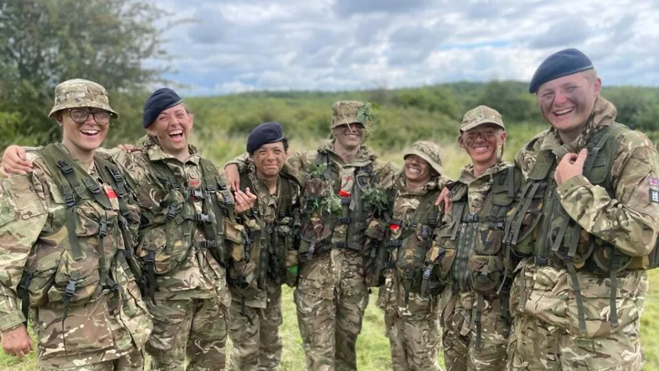 Cadets smiling during field craft